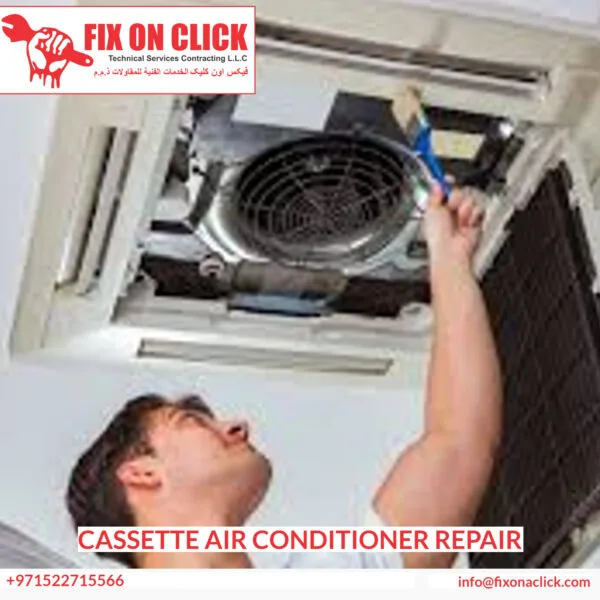 Fix On Click technician repairing a ceiling cassette AC unit in a Dubai office