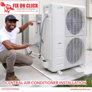Technician commissioning a central AC condenser unit at a Dubai villa