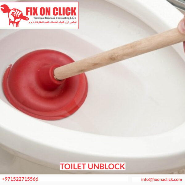 Plumber using professional drain clearing equipment on blocked toilet in Dubai apartment