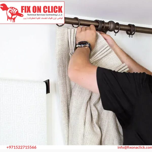 Fix On Click technician installing curtain rod and brackets in Dubai apartment