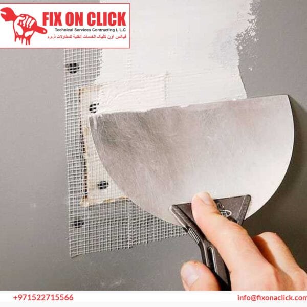 Plumber using professional drain clearing equipment on blocked toilet in Dubai apartment