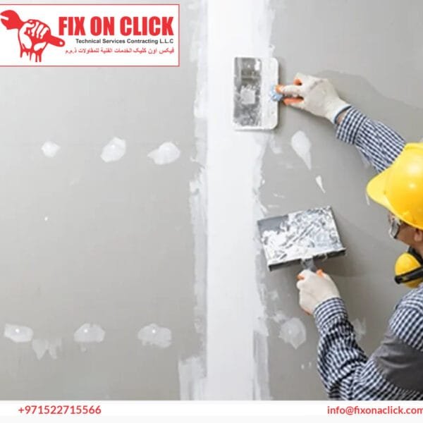 Drywall Repair Dubai - Fix On Click specialist repairing a damaged wall section