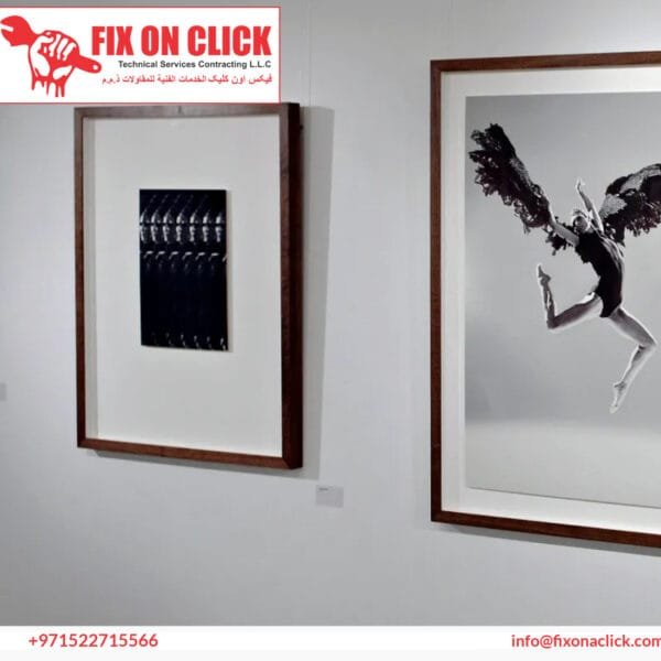 Professional picture mounting in a Dubai home