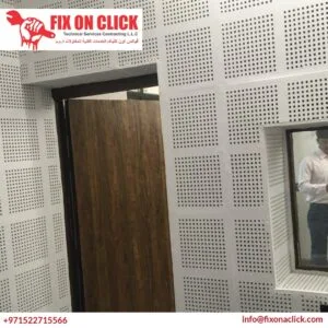 Fix On Click acoustic technicians installing layered soundproofing panels in Dubai