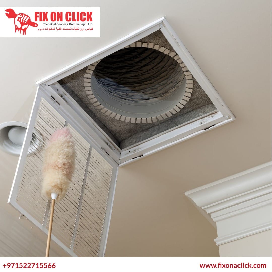 HVAC technician inspecting and cleaning AC ductwork inside Dubai property