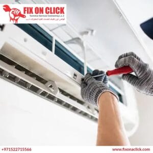 Fix on Click technician repairing AC indoor unit in Dubai Marina high-rise apartment