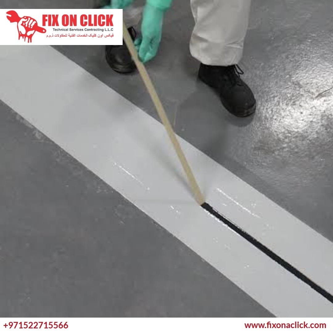 Expert applying polyurethane sealant into a concrete joint
