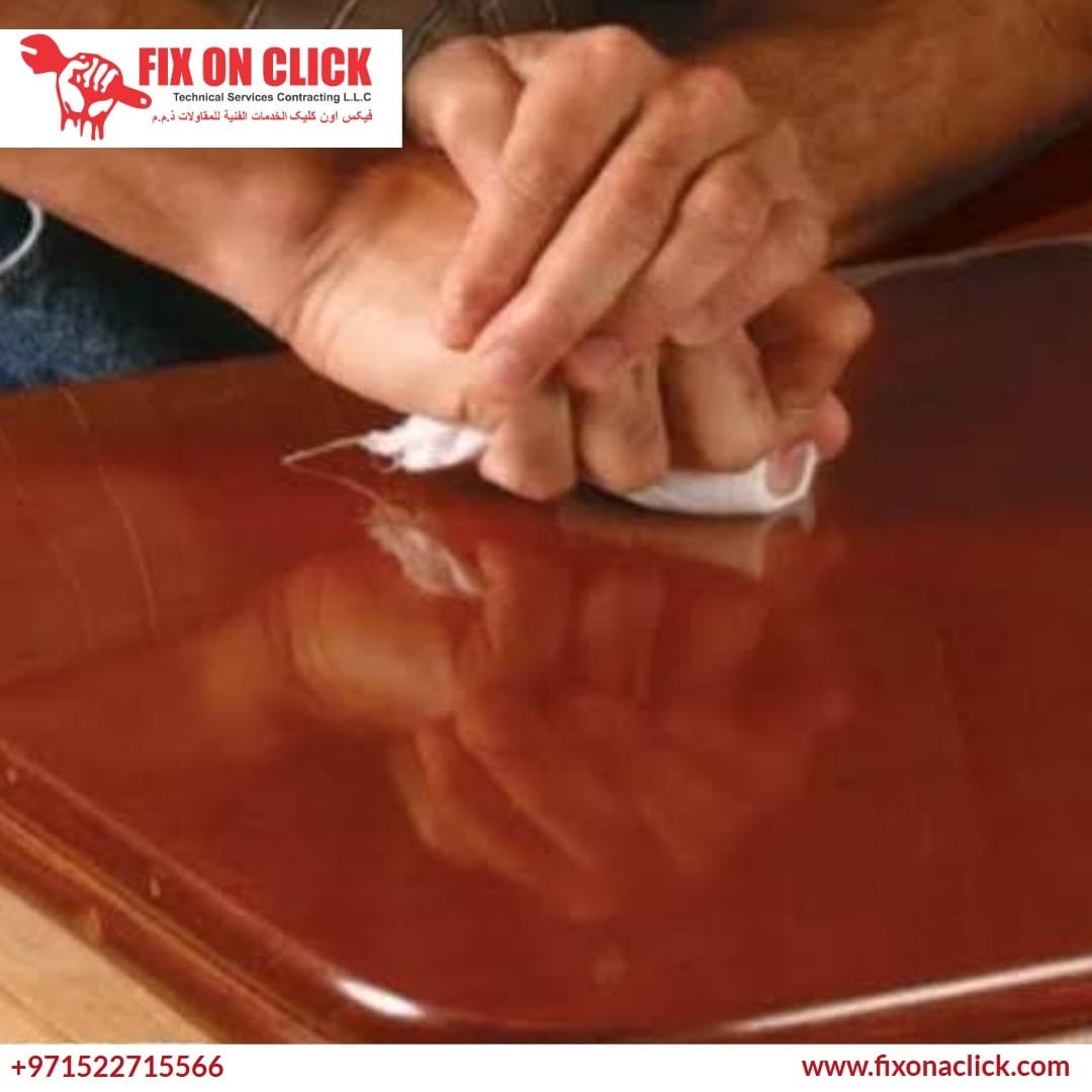 Fix On Click specialist applying varnish to wooden furniture