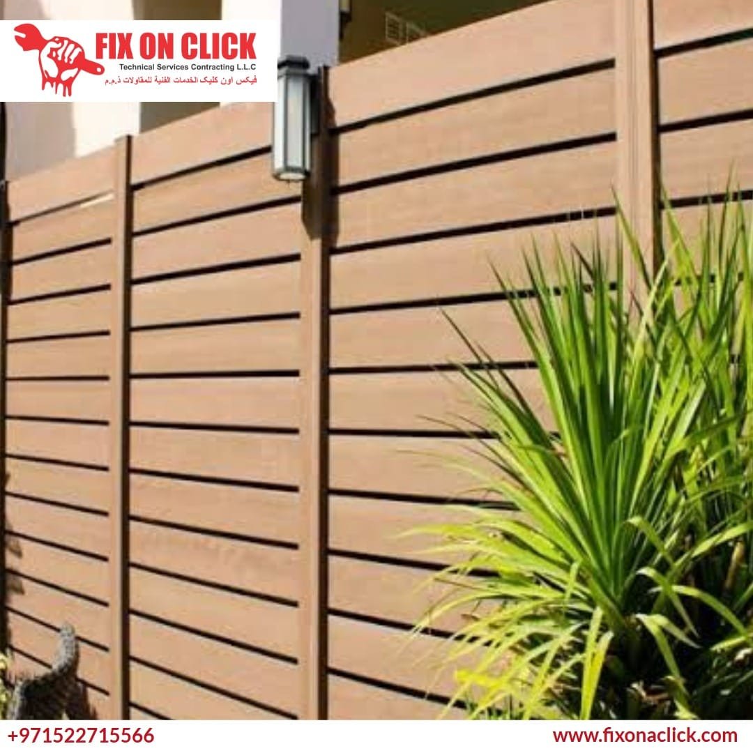 Expert carpenter building a strong garden fence