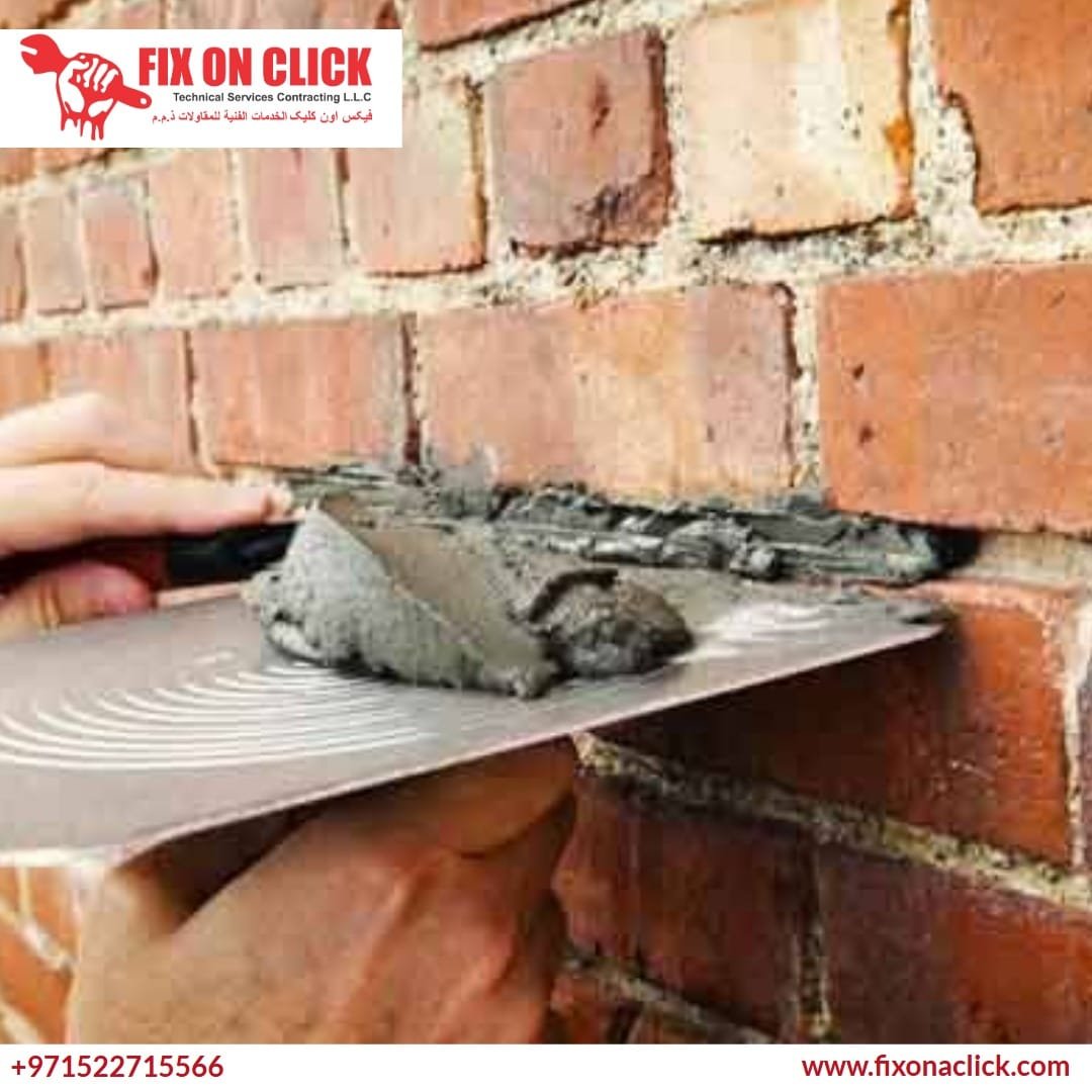Professional applying drywall compound to a wall