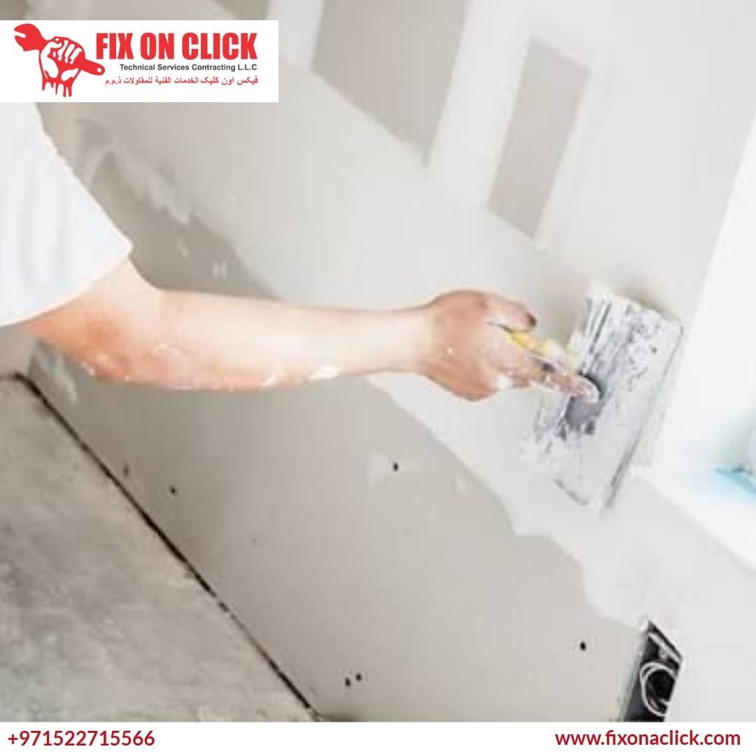 Fix On Click professional repairing a damaged wall