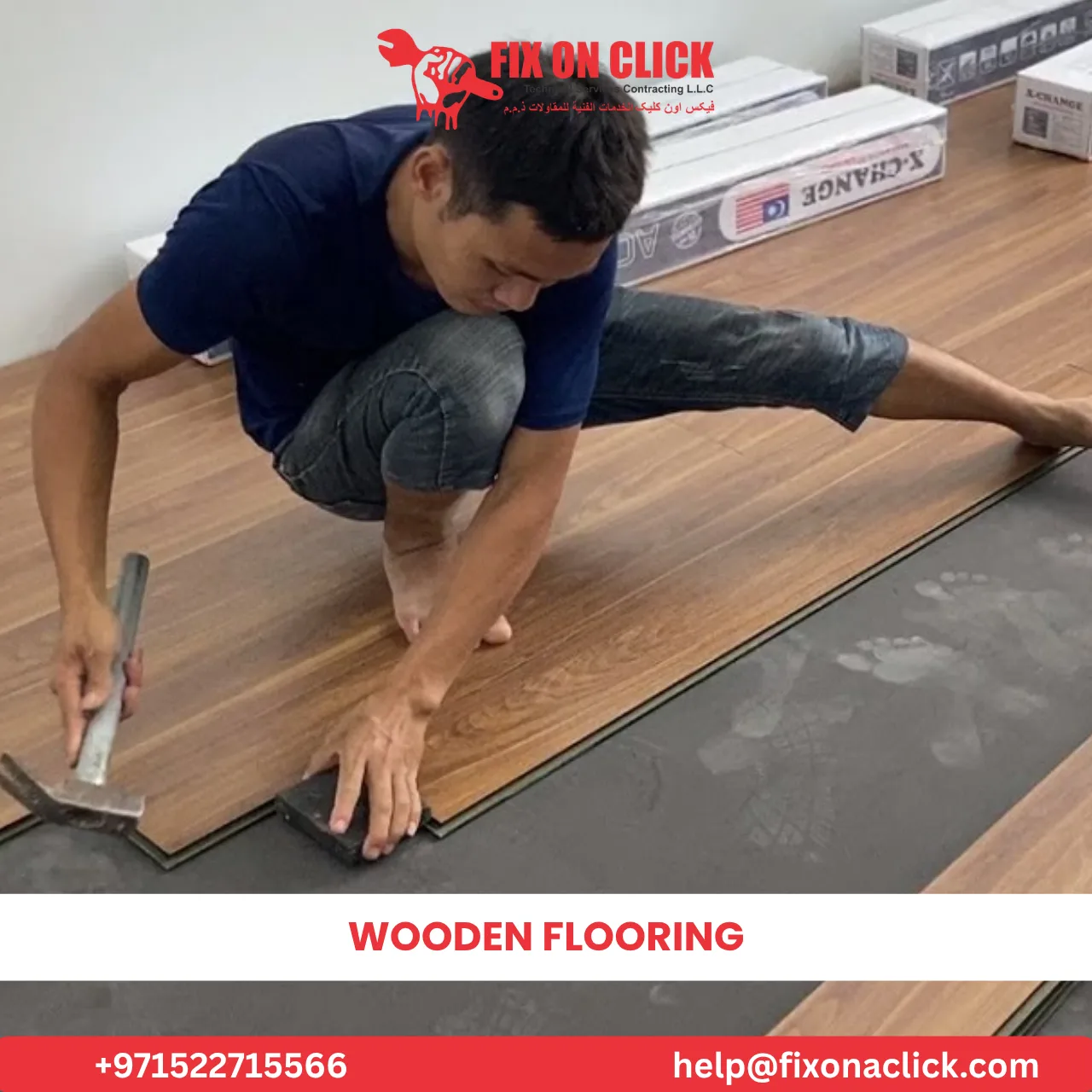 Carpenter repairing damaged wooden floor boards in Dubai